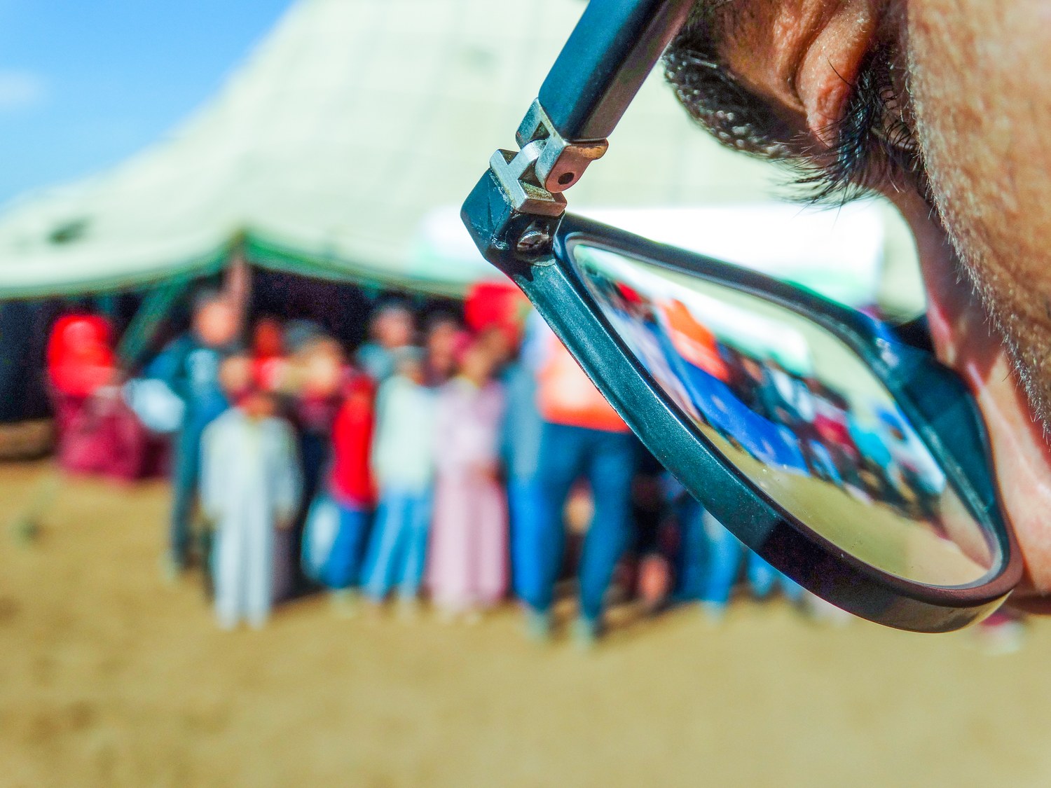 Le reflet de la rencontre CCM dans les lunettes d’un participant.